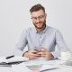 portrait-delightful-male-with-stubble-fashionable-hairdo-chatts-with-girlfriend-via-social-networks-has-happy-look_273609-8209